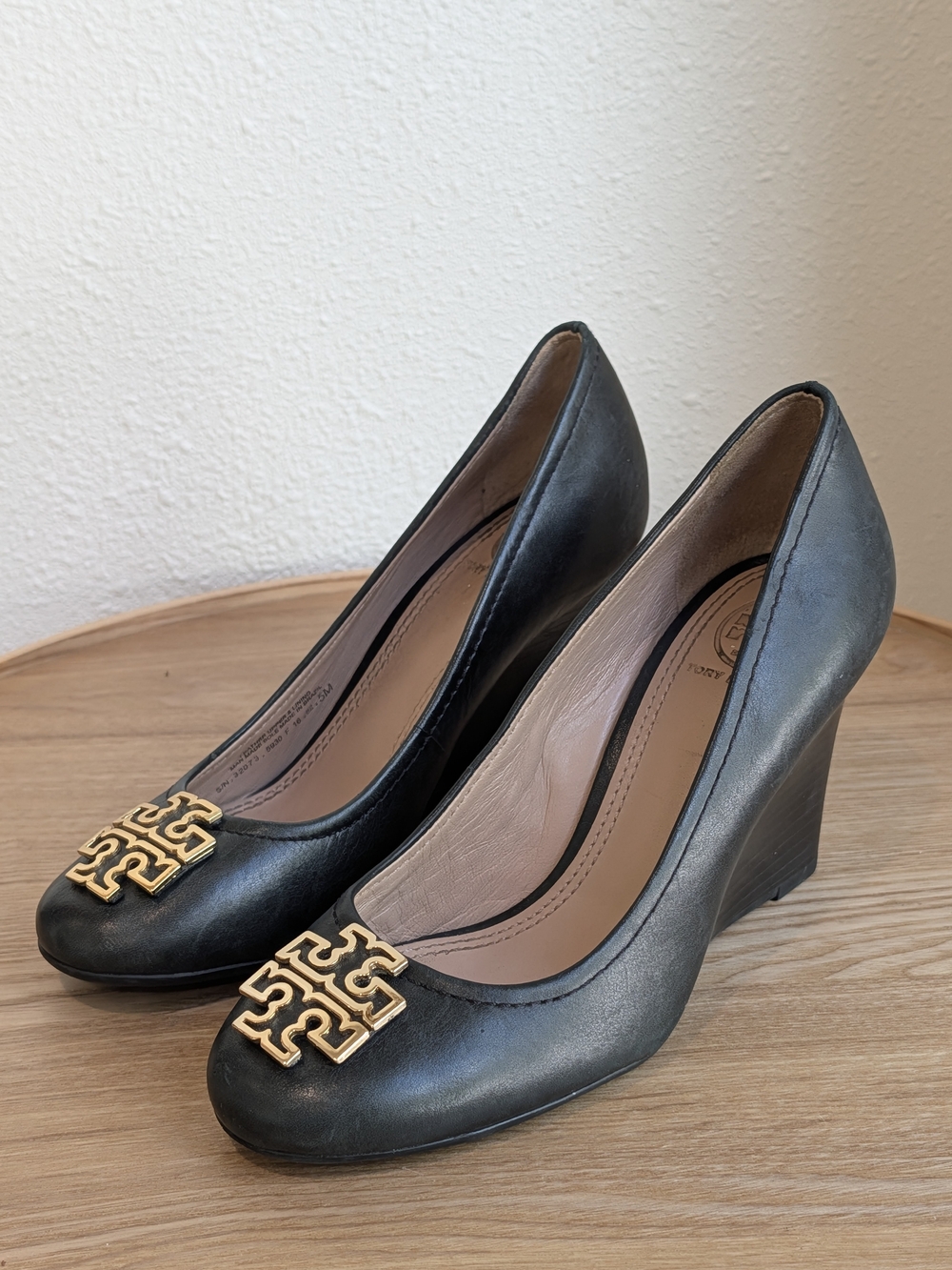 Tory Burch Black Leather Wedge Pumps with Gold Logo Accent